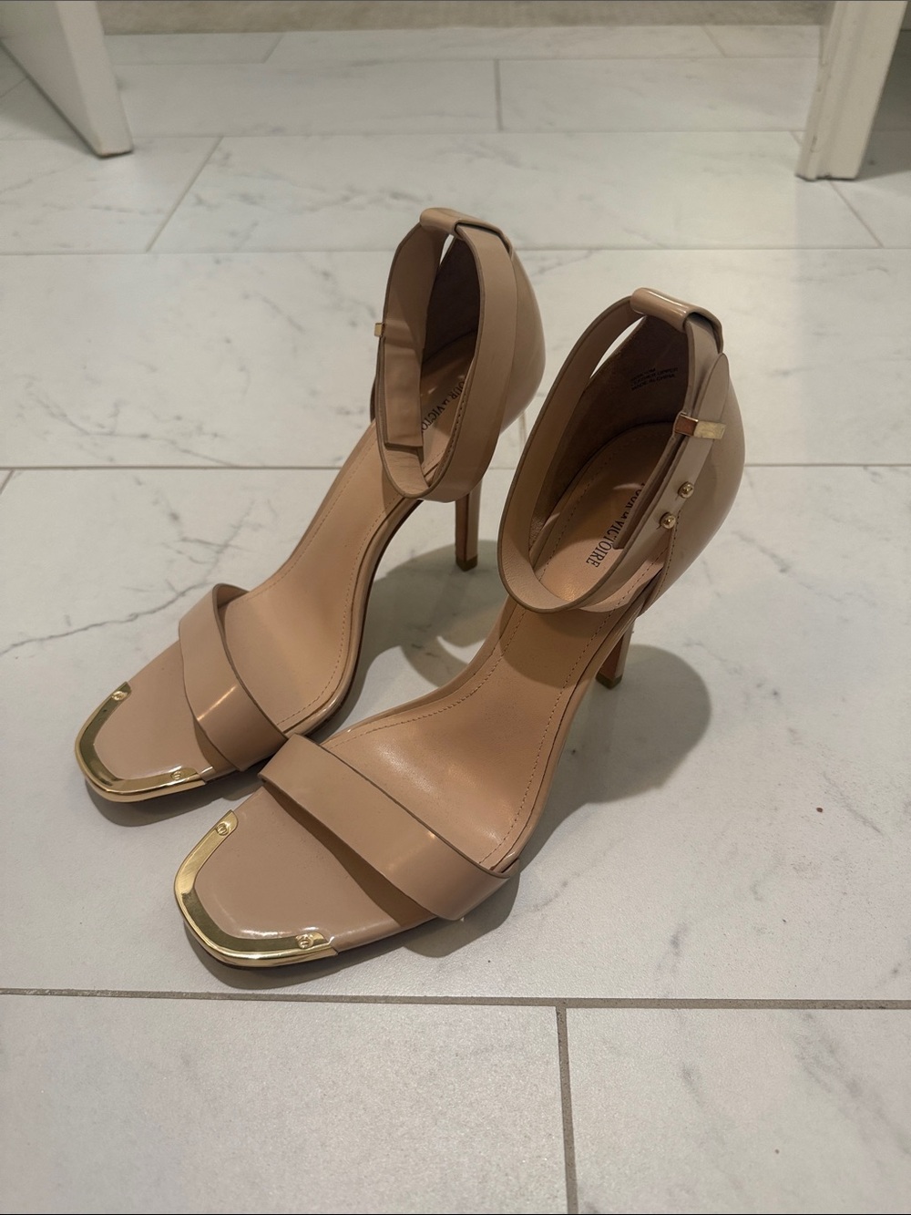 Pour La Victoria Nude Ankle-Strap Stiletto Sandals with Gold Accent, Size 10